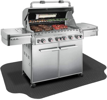 Oversized Resilia under grill mat, shown in situ under a large gas grill, on a white ground
