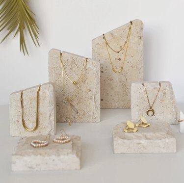 Jewelry displayed on limestone pieces
