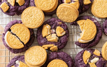 Ube Oreo cookies on a wire rack.