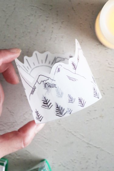 DIY paper lantern with a drawing of mountains and trees