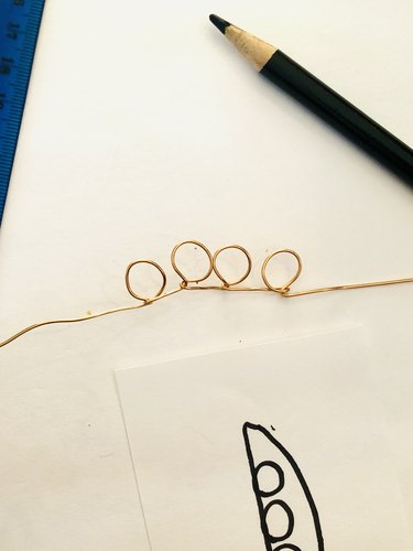 An image of a wire that has been twisted into four loops