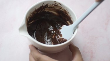 Smooth chocolate ganache in a bowl