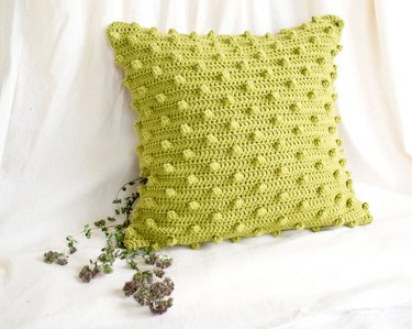 Square cotton crochet pillowcase in a bright pistachio green