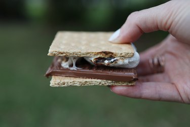 Close-up of a hand holding s'mores
