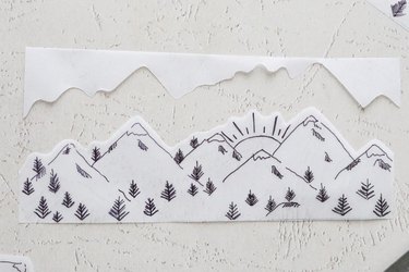 Drawing of mountains and trees on vellum