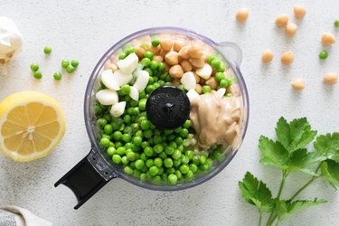 Green pea hummus ingredients in food processor
