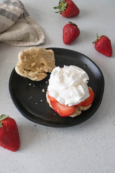 Biscuit with strawberries and whipped cream