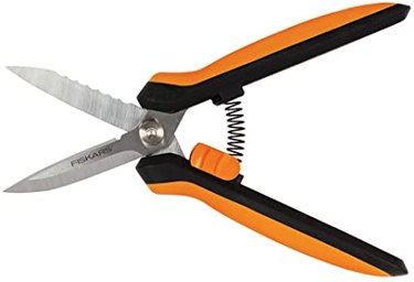 Gardening snips with stainless steel blades, a spring action function, and soft, orange and black handles against a white background.