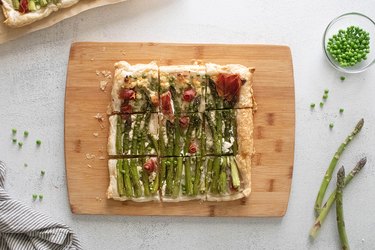 Asparagus tart with herbed cheese and prosciutto