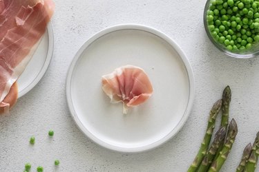 Prosciutto flower on white plate