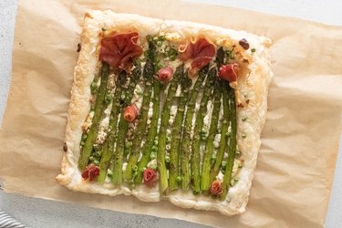 Asparagus tart with herbed cheese and prosciutto