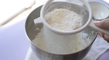 Sifting dry ingredients into meringue