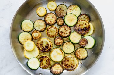 sauteeing the zucchini until caramelized