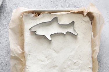 Cutting out ice cream with shark cookie cutter