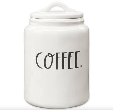 White ceramic coffee canister that says "Coffee." in a handwritten, all-caps font.