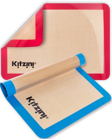 Kitzini silicone baking mats in two colors, shown against a white ground