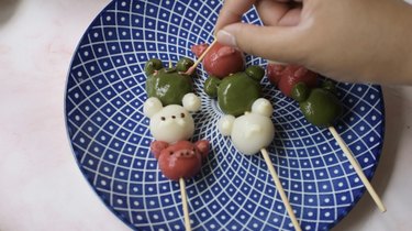 Decorating animal dango with melted chocolate