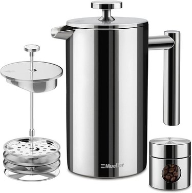 An all-stainless steel Mueller Austria French Press shown with the interior parts.