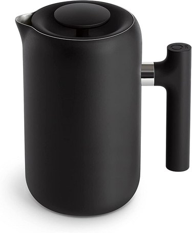 A Fellow Clara French Press in matte black with a sleek, straight handle.