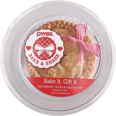 Pyrex glass pie plate, shown in retail packaging on a white ground