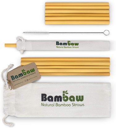 Pack of 12 bamboo straight straws with a cleaning tool and carrying pouch.