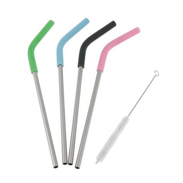 4 stainless steel reusable straws with different colored silicone tips and a cleaning brush.