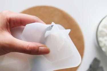 Poking hole in the bottom of a silicone gem mold