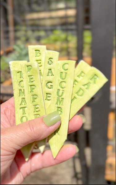 finished clay garden markers heading for the garden