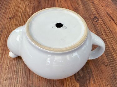 Drilled hole in bottom of teapot