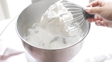 Egg whites in stiff peak form on KitchenAid whisk attachment