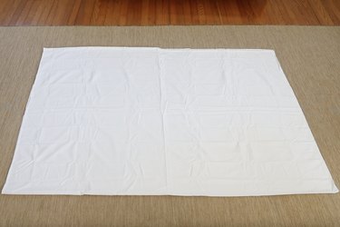 Twin bed sheet folded in half