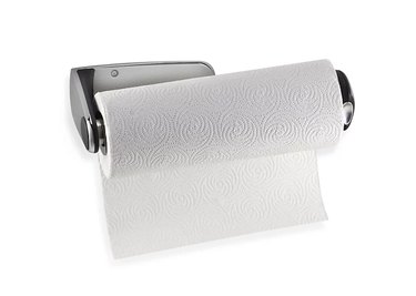 Wall-mounted paper towel holder with a stainless steel finish against a white background.