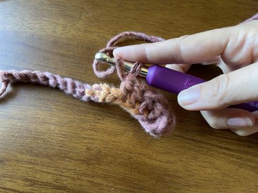 A double crochet stitch in progress