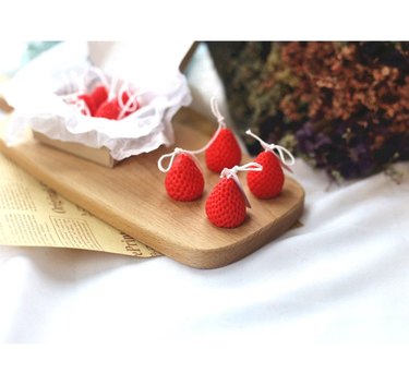 Set of four strawberry-shaped candles