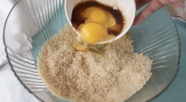 Adding eggs and vanilla to lemon sugar..