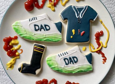 Father's Day sugar cookie set, including grass-stained sneakers, holey socks and condiment-stained polo shirt