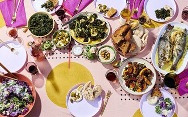 A lovely spread of food on a pink table