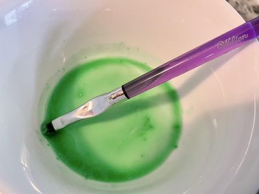 green royal icing watered down with purple brush