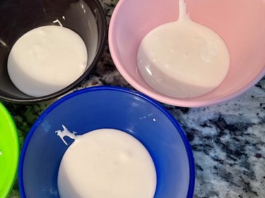 black, pink, and blue bowl, each with royal icing