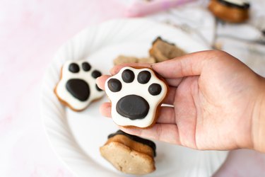 Holding a paw print madeleine