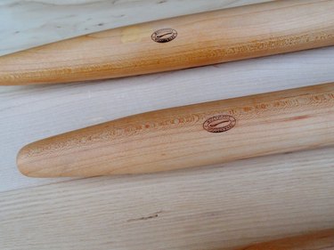 Whetstone Woodenware French-style rolling pins, shown in closeup on a wooden countertop