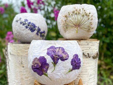 Three finished pressed-flower paper lanterns