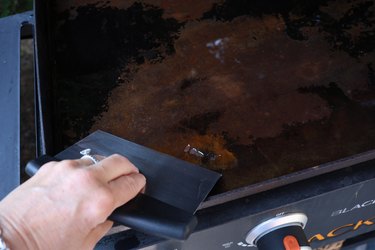 scraping surface of flat top grill