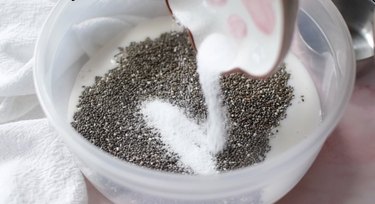Adding sugar to bowl of chia seeds and milk.