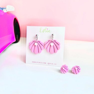 Candy pink seashell earrings on white card