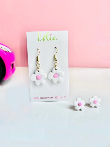 Pair of white flower earrings with pink centers