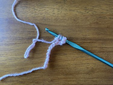 Wrap yarn and pull through the first two stitches on your crochet hook