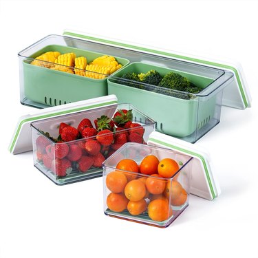 Fruit and vegetable inside four containers with lids off