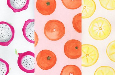 Three side-by-side watercolor prints of colorful dragonfruits, mandarin oranges, and lemon slices