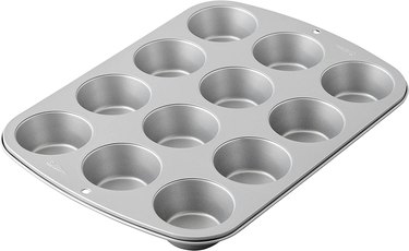 Wilton steel non-stick Recipe Right muffin pan, shown in 3/4 view on a white ground